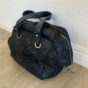 Chanel Biarritz Quilted Bag. Black coated canvas with silver hardware.